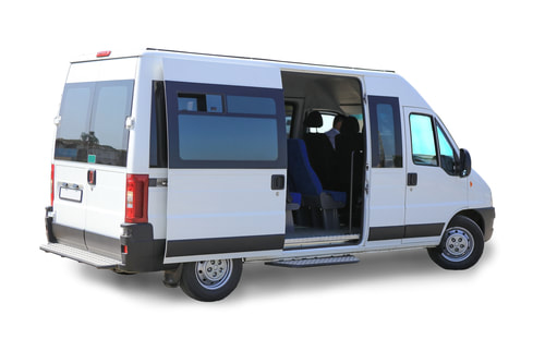 White van with open side door.